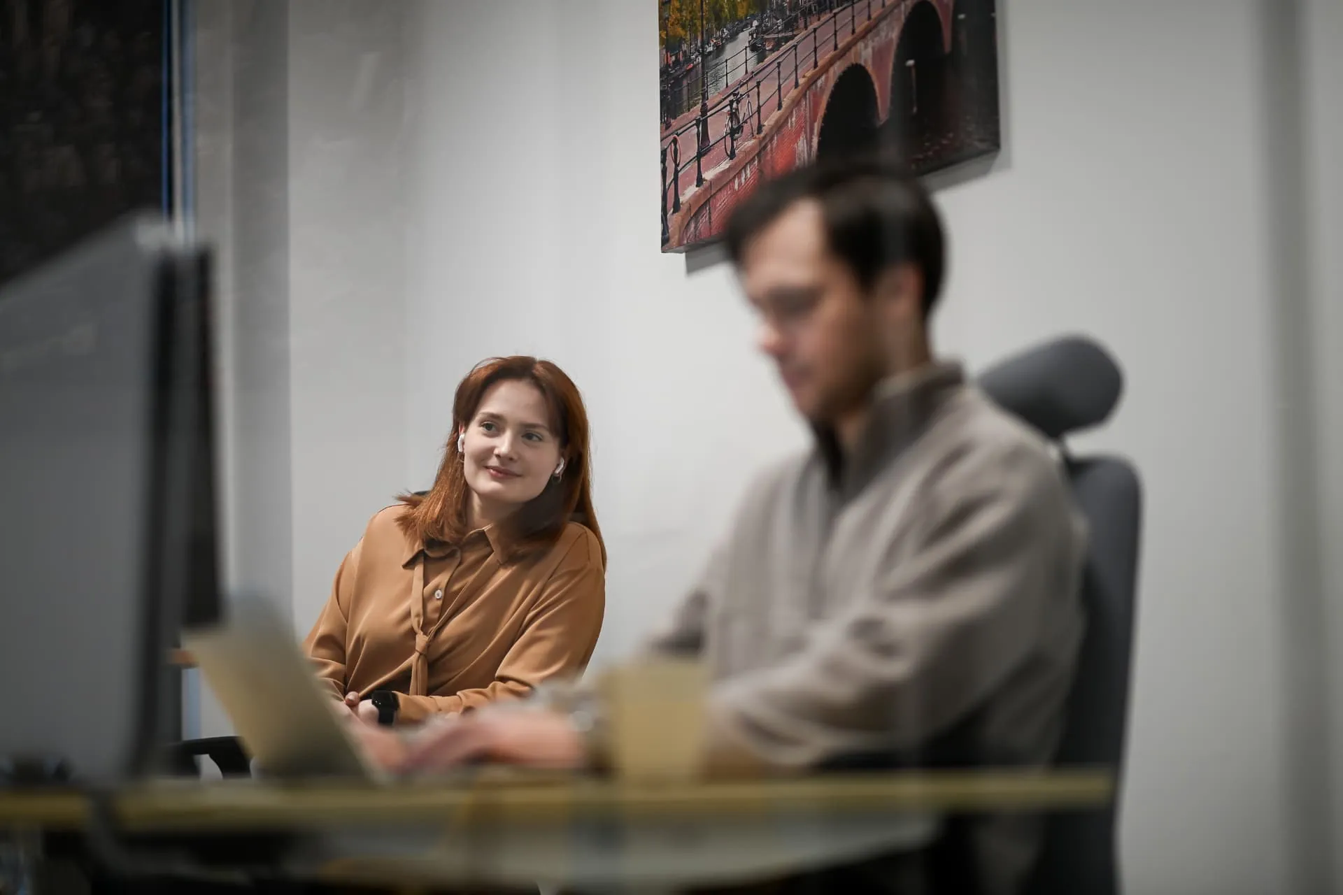 A colleague listening during a discussion