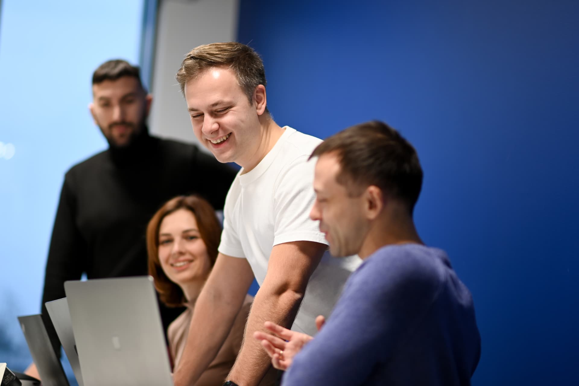 Weissr team working together at a laptop